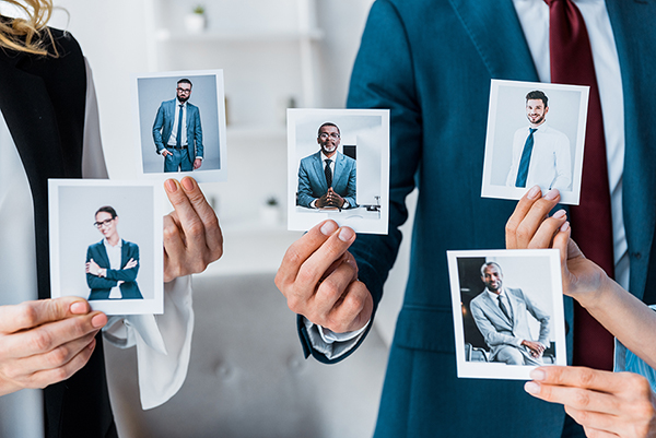 Company spokespersons display images of its leaders