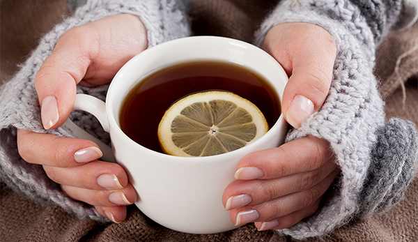 Cup of tea with a slice of lemon in it